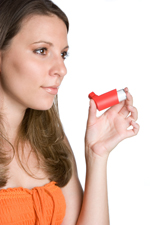 woman holding inhaler